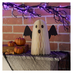 Cream-colored ghost sitter accordian paper decoration with honeycomb texture black bat wings and simple face design