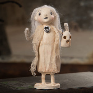 A whimsical off-white porcelain ghostly grace figurine with long white hair holding a skull pendant and carved mask perfect for halloween ghost figures decor and ornaments