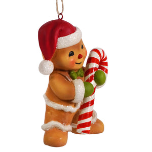 A cheerful gingerbread george ornament wearing a red santa hat and holding a candy cane retro deer ornament by bethany lowe figural decor