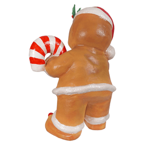 A festive gingerbread george figurine by bethany lowe designs wearing a red white santa hat and holding a candy cane gingerbread decor