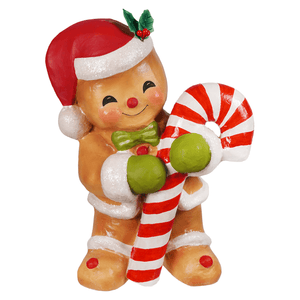 A cheerful gingerbread george figurine by bethany lowe designs wearing a santa hat and holding a candy cane for gingerbread decor