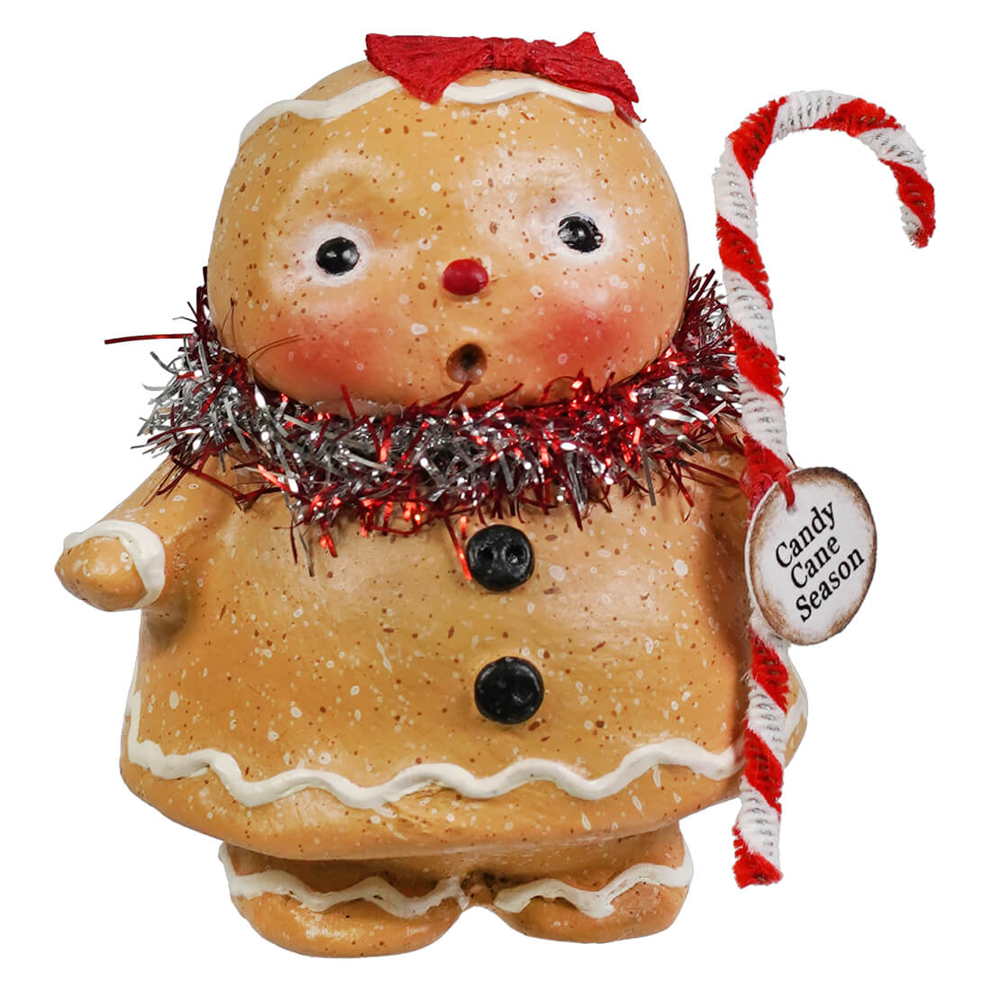 A gingerbread girl figurine with white icing and tinsel scarf from bethany lowe designs gingerbread decor