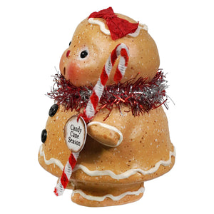 A charming gingerbread girl figurine with speckled tan surface white icing and red tinsel from bethany lowe designs gingerbread decor