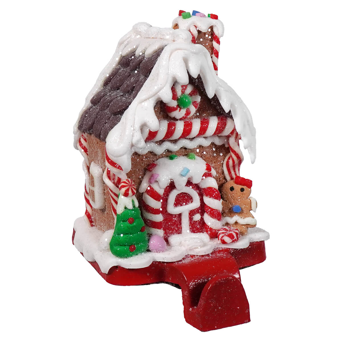 Festive gingerbread house stocking holder with brown candy-striped roof and white icing details for christmas stockings