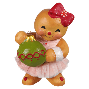 A cheerful gingerbread joy girl ornament by bethany lowe designs with red bow, pink tutu, holding green christmas ball