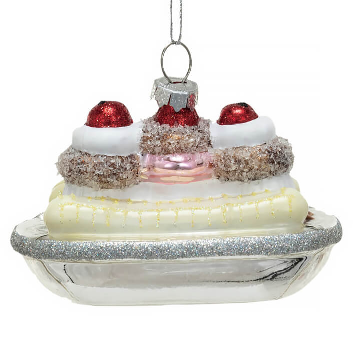 Glass ornament shaped like a banana split dessert with sparkly decorations.