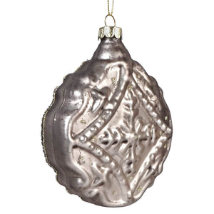 Silver mercury glass sequined champagne disk ornament with intricate embossed patterns and subtle gold flecks