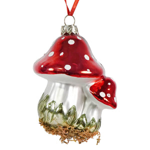 Glossy red and silver mushroom glass ornament with white polka dots and green glittery grass for figural decor