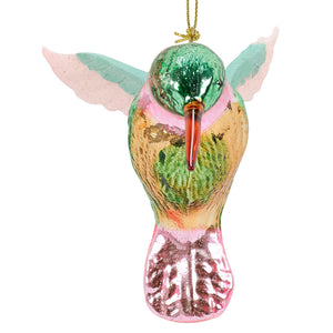 A vibrant glass hummingbird ornament with teal wings and a pink-tipped tail perfect for decoration