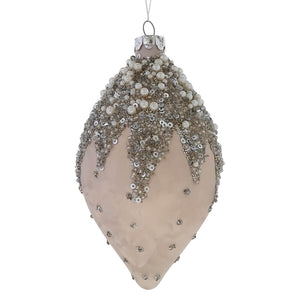 Glass ivory beaded drop ornament with silver sequins and white pearls on a light beige base for vintage christmas decor