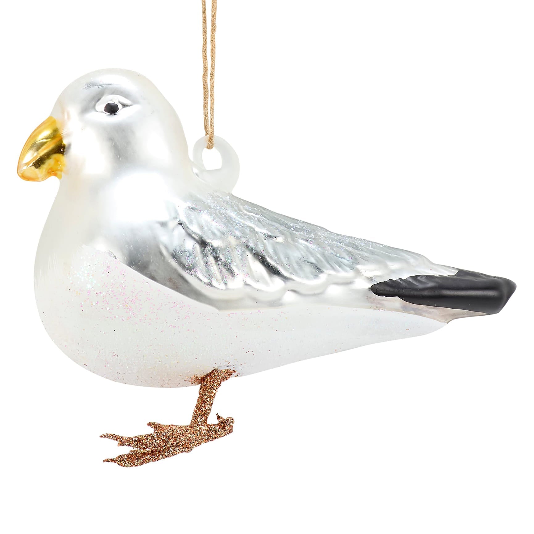 A shiny silver glass seagull ornament with a gold beak black-tipped wings perfect for sea and beach themed ornaments