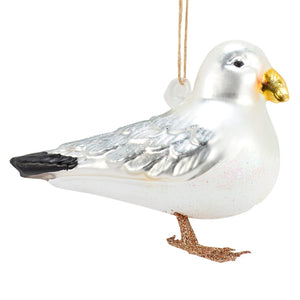 Glass seagull ornament made of translucent white glass with silver glitter wings gold beak and copper feet perfect sea and beach themed ornament