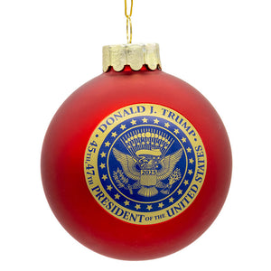 Red glass trump ball ornament with gold blue presidential seal from glass trump ball commemorative collection by kurt adler