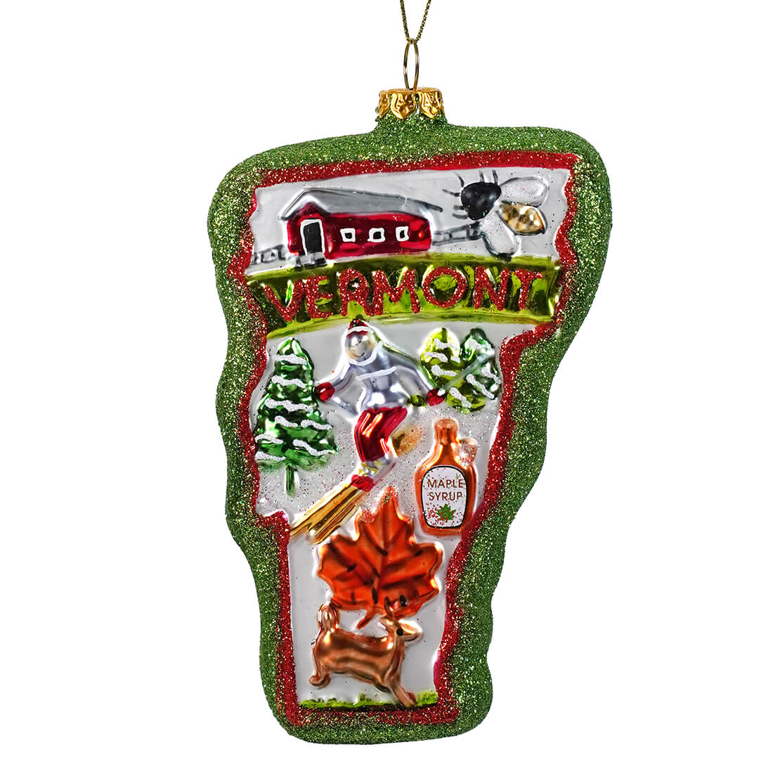 Glass Vermont state ornament with glittery green border featuring red barn maple syrup bottle and autumn leaf design