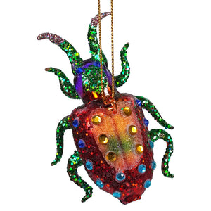 Sparkly spider-shaped ornament decorated with colorful glitter and jewels.