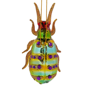 A glittered purple spotted forest floor bug ornament with iridescent glass body and gold glittered legs cody foster ornament