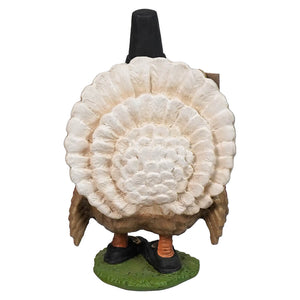 Decorative turkey-shaped wine bottle holder with a ruffled white plumage body and orange feet.