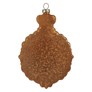 A rustic copper-toned gold glass virgin mary and child ornament with scalloped edge and speckled texture perfect for nativity and religious ornaments