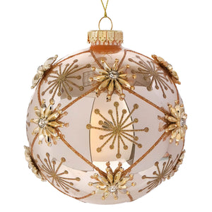 A translucent blush pink raz imports jewel ball ornament with gold glitter starbursts and crystal center flower decor