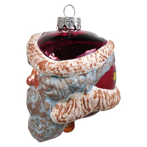 A gorenaments evil santa glass ornament with a textured frosty blue and white beard and hat topped with a red cap
