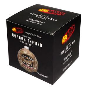 Gorenaments mummyzy halloween ornament featuring a beige and brown glass mummy face with yellow eyes, perfect spooky pumpkin ornament