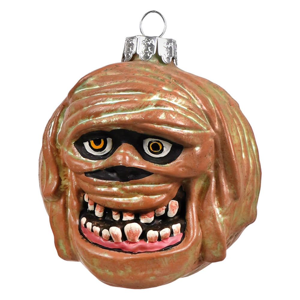 A glossy terracotta glass mummy ornament with painted eyes by gorenaments perfect for halloween ornaments