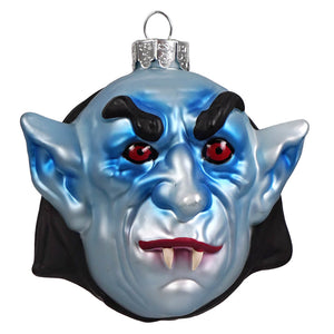 Blue glass vampire glass ornament with red eyes black eyebrows and fangs by gorenaments kurt adler