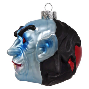 Glossy glass ornament shaped like a half-blue half-black vampire head with red eyes by kurt adler