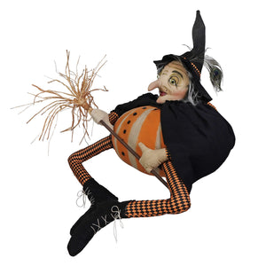 Orange and black checkered gourdisha witch figurine holding a broomstick with a pumpkin personally inspected by joe spencer