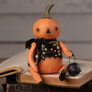 Orange pumpkin sitter figurine in black polka-dot dress holding black lantern from bethany lowe halloween figures & dolls