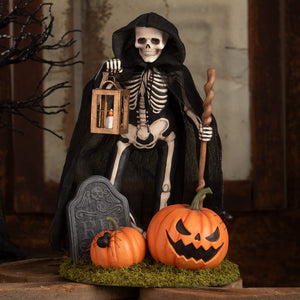 Gravesyard gideon skeleton decor figure in black hooded cloak holding lantern and staff with pumpkins on mossy base