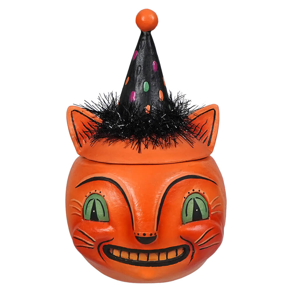 Orange cat-shaped candy jar with black polka-dotted jester hat and tinsel perfect for halloween cats and green eyed copper cat fans