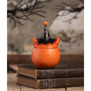 Orange ceramic witchs cauldron with black polka dot hat and fuzzy trim for halloween cats green eyed copper cat decor