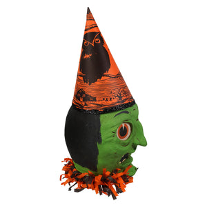 Vandolls folk art green faced crone witch head decoration in green and black with orange pointed hat and crow by rachel garrison