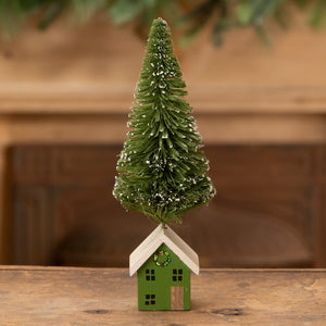 Green house bottle brush tree with white roof and miniature evergreen topped with snowflakes for vintage christmas village trees