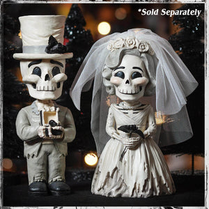 White skeleton bride and groom figurines in wedding attire with groom holding ring box perfect skeleton decor figures and ornaments skelly