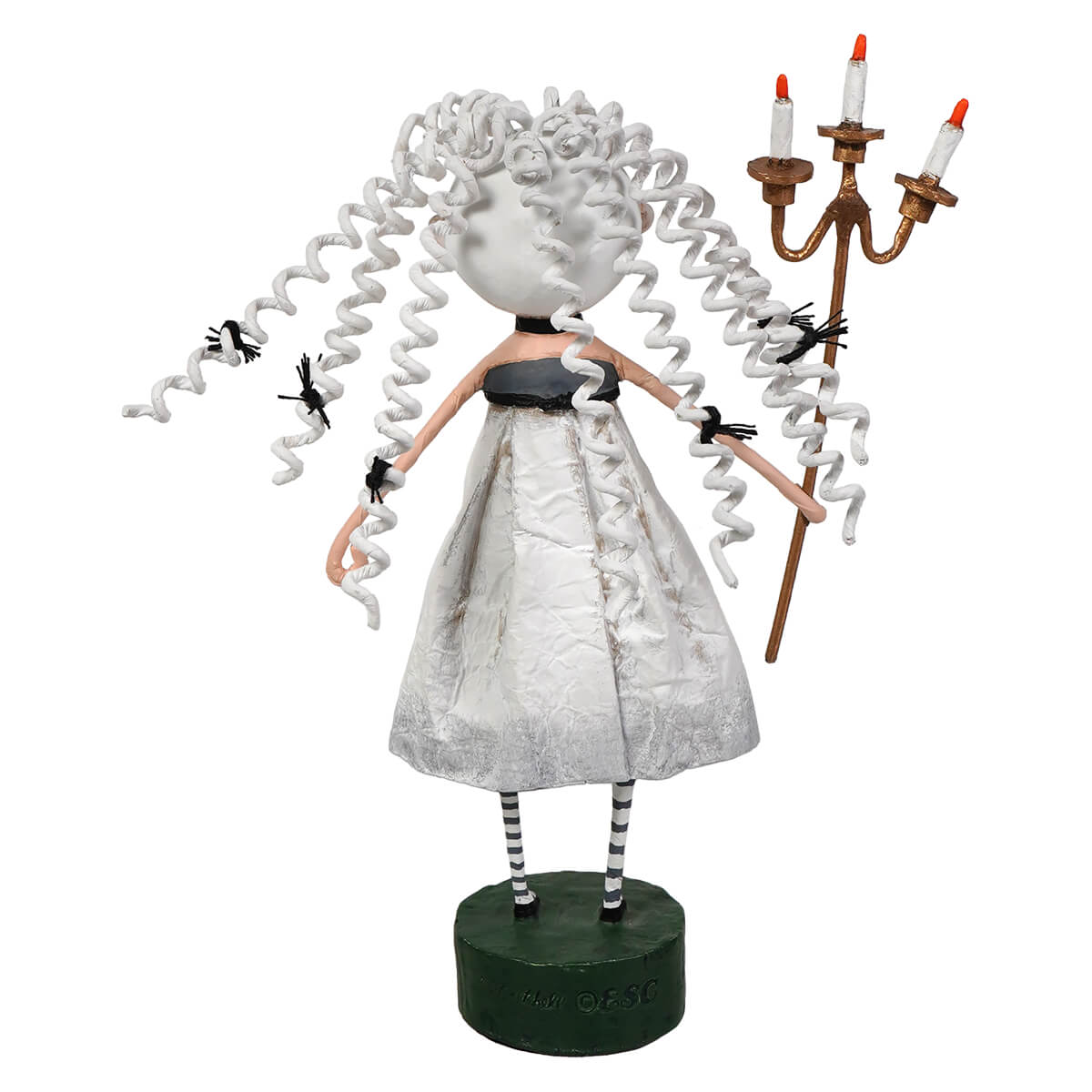 White curly-haired lori mitchell figurine in silver dress holding a three-candle candelabra guiding light halloween decor