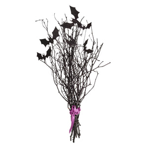 Black glittery halloween bat bouquet made of decorative twigs tied with a purple ribbon for spooky decor