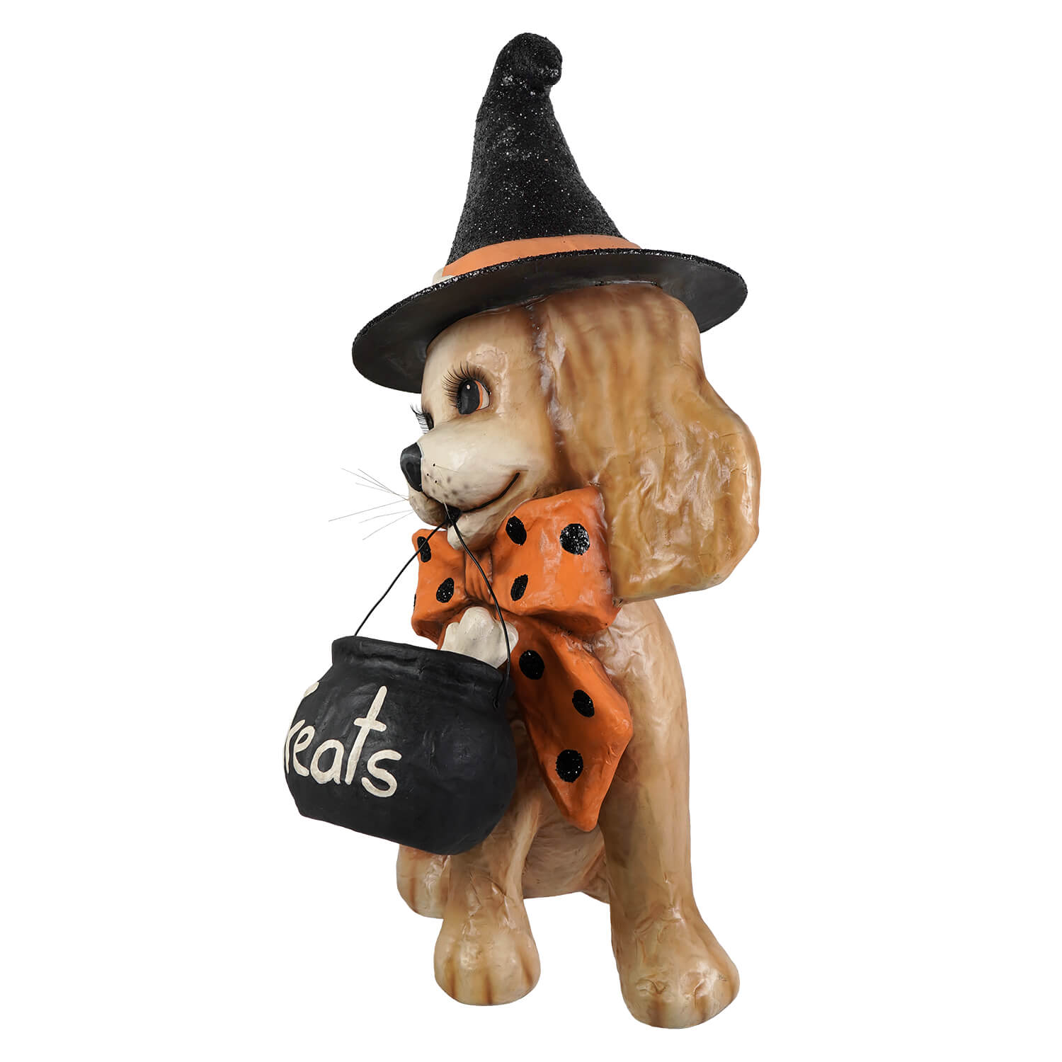 A tan resin halloween frankie witch dog figurine wearing a black glittery hat holding a treat cauldron with an orange bow