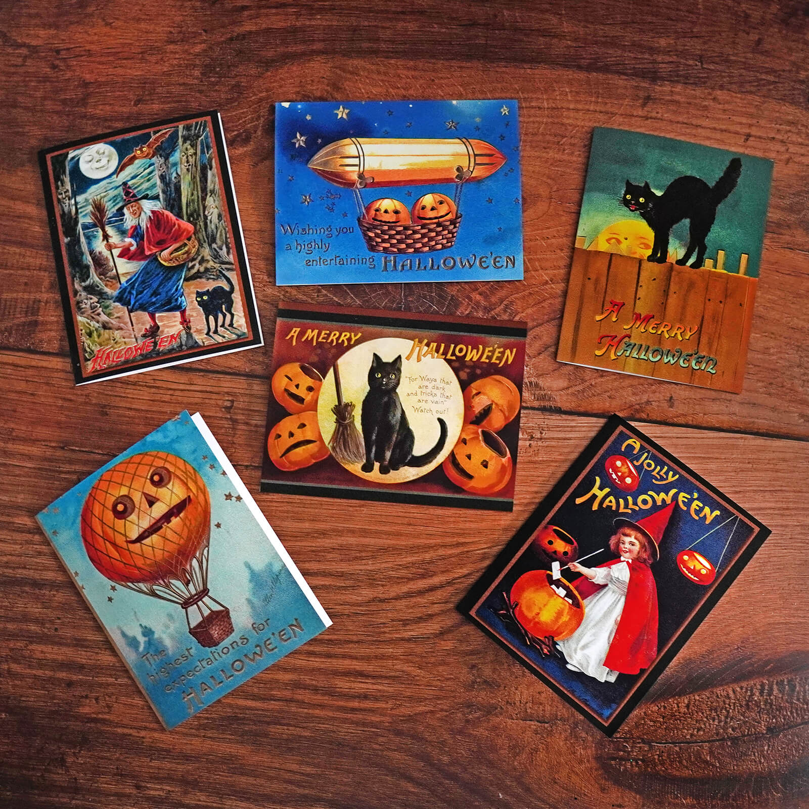 Vintage halloween greeting cards set of 6 with whimsical witches black cats jack o lanterns and hot air balloons on wood