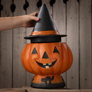 Orange halloween jack o lantern candy bucket shaped like a pumpkin with black witch hat and carved facial features