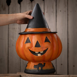 Orange halloween jack o lantern candy bucket shaped like a pumpkin with black witch hat and cat silhouette base