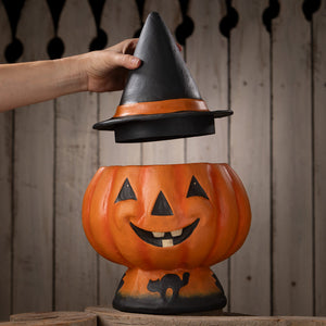 Orange plastic halloween jack o lantern candy bucket with black witch hat lid featuring cutout eyes and mouth
