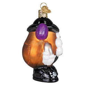 A glossy orange glass potato head ornament with black boots white gloves and a purple glittery nose for tabletop decor