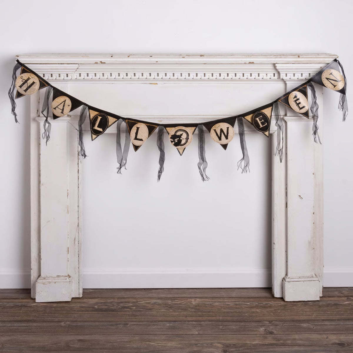 Black and beige halloween pennant garland with triangular flags featuring letters and spooky designs for halloween decor