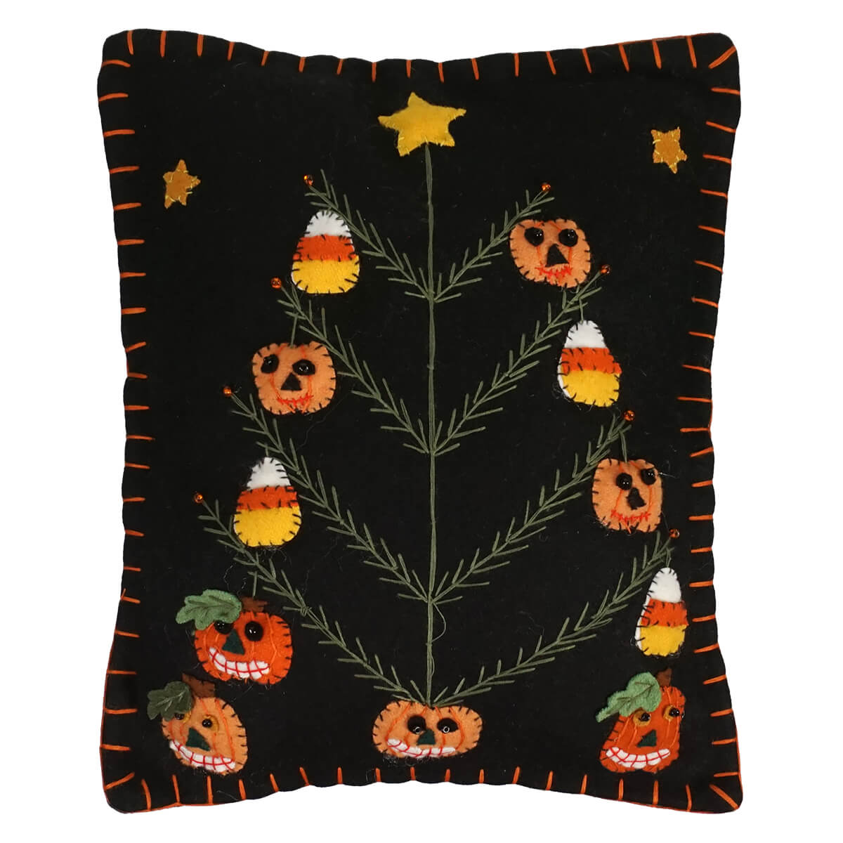 Black halloween pillow featuring a halloween tree decorated with candy corn and pumpkins design with orange stitching