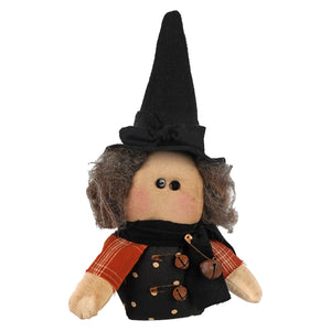 A handcrafted itty bitty witch doll with a tall black hat orange plaid sleeves and wooden bell buttons for figural decor