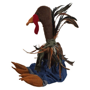 Handcrafted large sitting brown plush turkey figurine with red wattle and blue denim overalls sitting turkey wearing pants