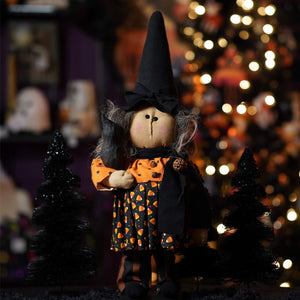 A handcrafted large standing candy corn dress witch doll with gray yarn hair and a tall black hat perfect for figural decor