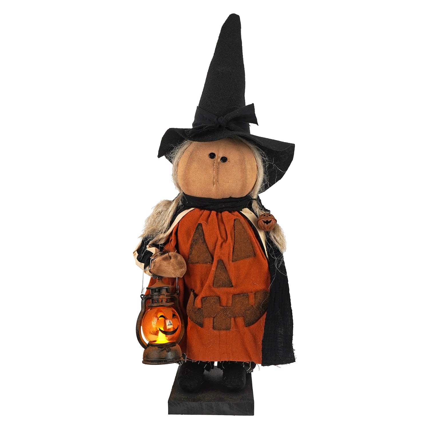 Handcrafted large standing pumpkin witch figurine with orange face black hat and cape holding glowing lantern perfect figural decor